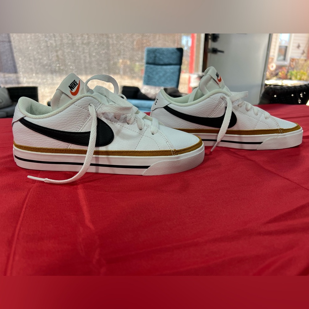 Nike White Sneakers with Gold and Black Accents